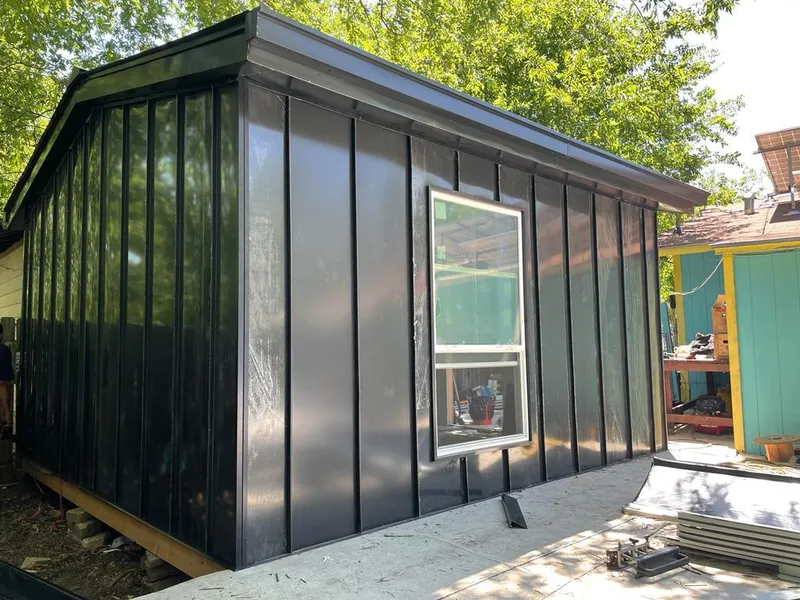 Black standing seam metal wall panels for Roof Inspection in Gulf Breeze