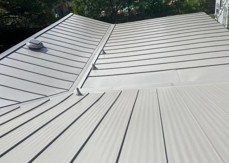 Solar attic fan installed on a metal roof for Roof Ventilation in Gulf Breeze